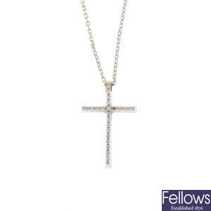 An 18ct gold diamond cross pendant and a chain.