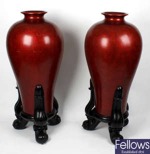 A pair of unusual large Chinese red lacquered vases.