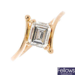 A diamond single-stone crossover ring.