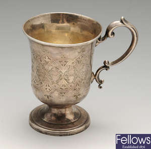 A mid-Victorian silver mug and a 1920's example.