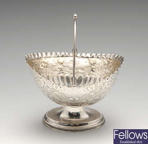 A late Victorian silver swing-handled sugar bowl, etc.