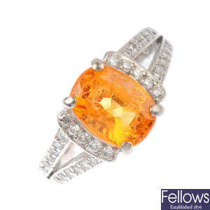 An 18ct gold fire opal and diamond dress ring.