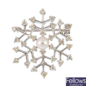 A diamond and cultured pearl brooch.