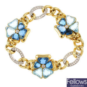 An aquamarine, topaz and diamond bracelet.