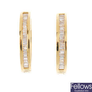 An 18ct gold and diamond pair of earrings and pendant.
