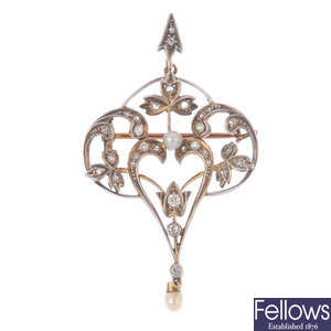 An early 20th century silver and gold gem-set pendant.