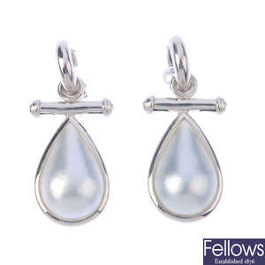 A pair of mabe pearl earrings.