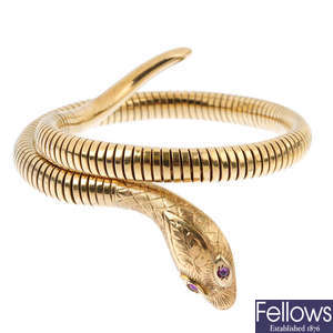 A 9ct gold ruby snake bangle.