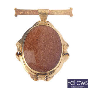 A goldstone brooch.