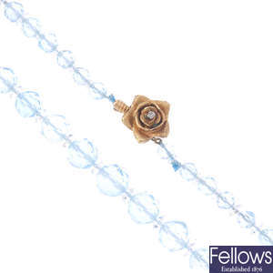 An aquamarine single-strand bead necklace.