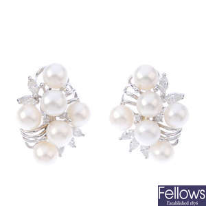 A pair of diamond and cultured pearl earrings.