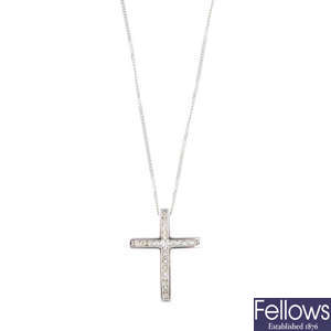An 18ct gold diamond cross pendant, with a chain.