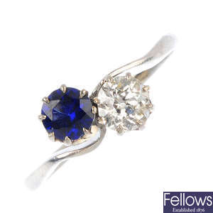 A synthetic sapphire and diamond crossover ring.