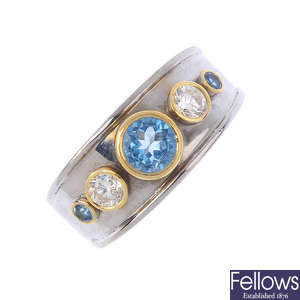 A topaz and diamond band ring.