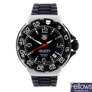 TAG HEUER - a mid-size stainless steel Formula 1 wrist watch.
