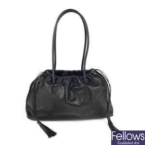GUCCI - a black leather handbag.