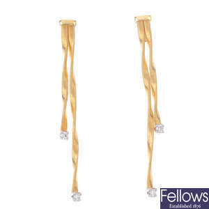 A pair of gold drop earrings with diamond detail