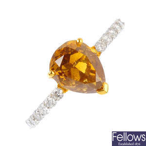 A 'yellowish-brown' diamond and diamond ring.