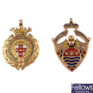 Two early 20th century 9ct gold enamel sporting medallions.