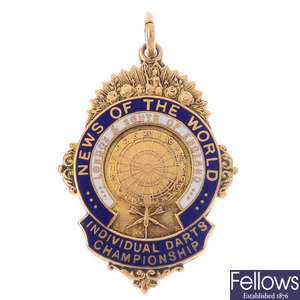 A 1930s 9ct gold enamel sporting medallion.