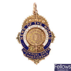 A 1930s 9ct gold enamel sporting medallion.