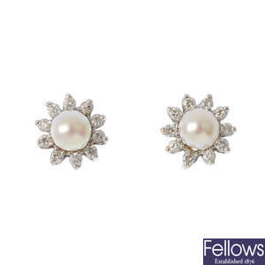A pair of cultured pearl and diamond cluster earrings.