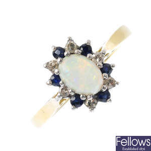 An 18ct gold opal, diamond and sapphire cluster ring.
