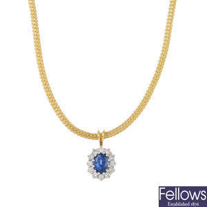 A diamond and sapphire cluster pendant, with chain.