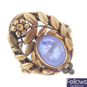 An Arts and Crafts gold sapphire dress ring.