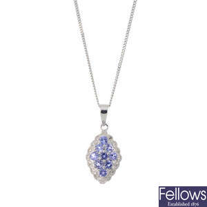 A 9ct gold tanzanite and diamond cluster pendant, with chain.