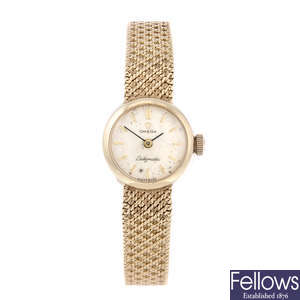 OMEGA - a lady's 9ct yellow gold Ladymatic bracelet watch.