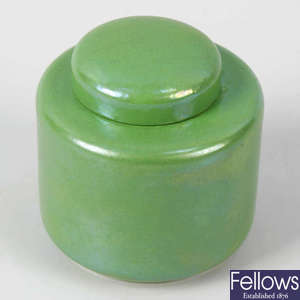 A small Ruskin pottery lustre jar and cover 