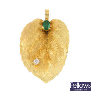 An 18ct gold emerald and diamond foliate pendant.