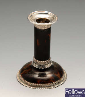 An Edwardian silver mounted and tortoiseshell candlestick and modern photograph frame.