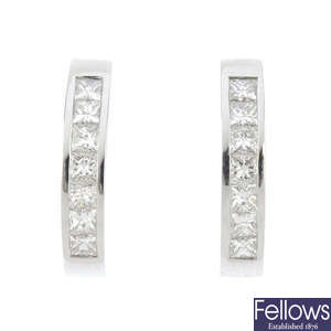 A pair of 18ct gold diamond earrings.