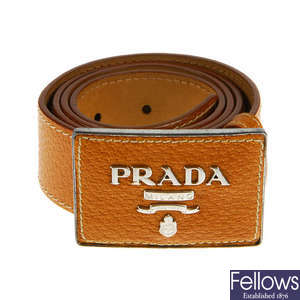PRADA - a tan leather belt.