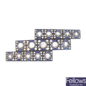 A diamond and synthetic sapphire brooch.