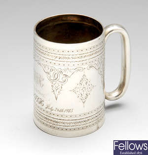A late Victorian silver christening mug, etc.
