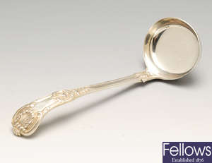 An early Victorian silver sauce ladle of double struck King's pattern, etc.