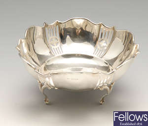 A George V silver dish, a 1930's toast rack and a berry spoon. (3).