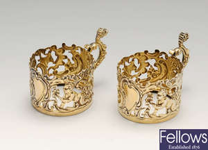A selection of silver items to a pair of late Victorian silver-gilt cup holders, etc.