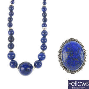 A lapis lazuli necklace, two pairs of earrings and a brooch.