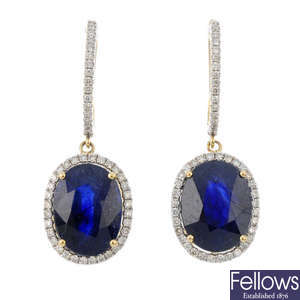 A pair of glass-filled sapphire and diamond earrings.