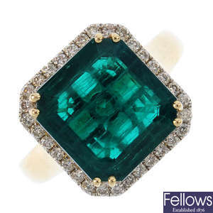 A synthetic emerald and diamond cluster ring.