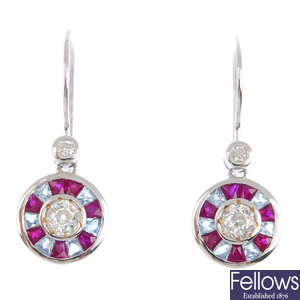 A pair of diamond, ruby and aquamarine earrings.