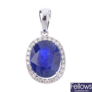 A glass-filled sapphire and diamond pendant.