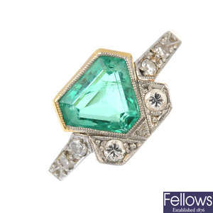 An Art Deco platinum and gold, emerald and diamond ring.