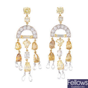 A pair of 'yellow', 'brown' and near-colourless diamond earrings.