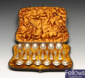 A Victorian cased set of twelve silver teaspoons, etc.