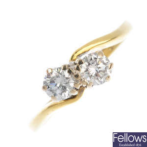 An 18ct gold diamond two-stone ring. 